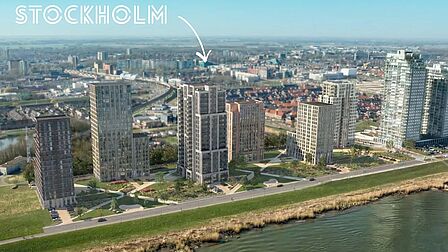 Impressie vanuit de lucht van woontoren Stockholm aan de Oude Maas in Spijkenisse.
