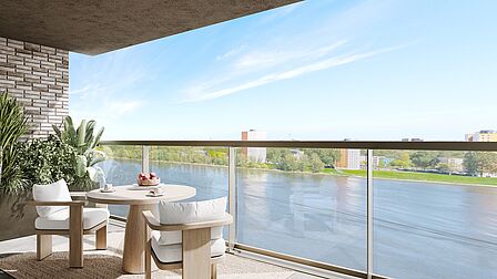 Impressie van het uitzicht over de Oude Maas vanaf een balkon in woongebouw Stockholm. 